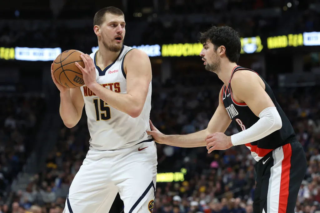 DENVER, COLORADO - FEBRUARY 10: Nikola Jokic #15 of the Denver Nuggets is guarded by Deni Avdija #8 of the Portland Trail Blazers in the first quarter at Ball Arena on February 10, 2025 in Denver, Colorado. NOTE TO USER: User expressly acknowledges and agrees that, by downloading and or using this photograph, User is consenting to the terms and conditions of the Getty Images License Agreement. (Photo by Matthew Stockman/Getty Images)